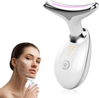 Facial massager device held by a person on a white background
