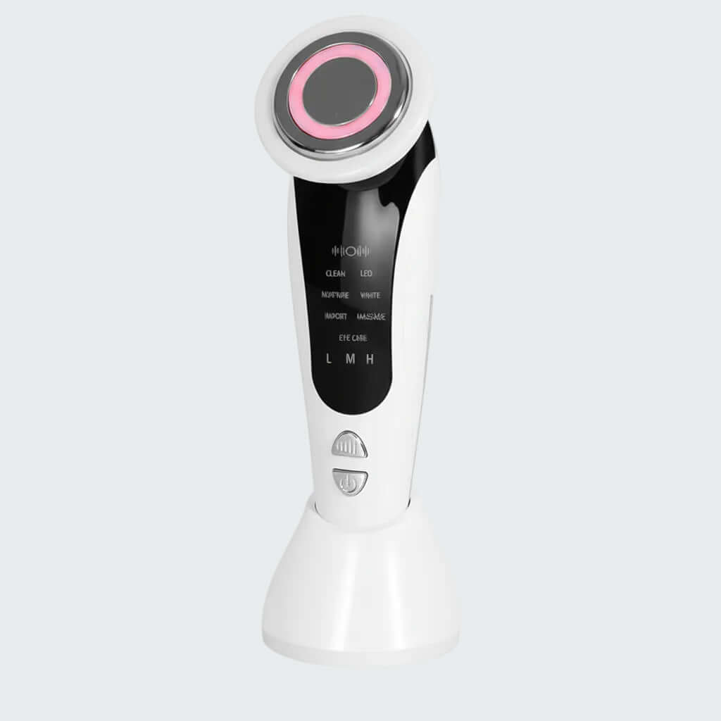 White induction device with pink accents and packaging on a white background