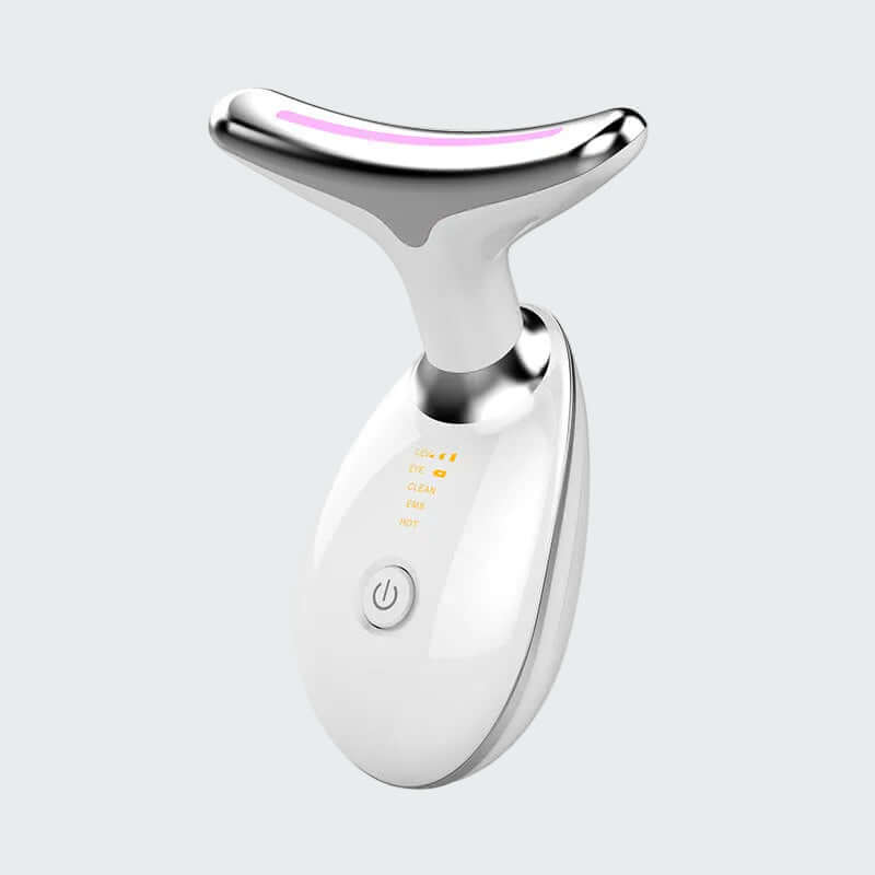 White and silver facial massager on a light gray background